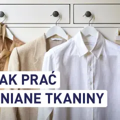 Jak prać len? Eleganckie lniane ubrania wiszą na wieszakach, gotowe do pielęgnacji.