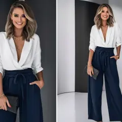 Elegancka kobieta w białej bluzce i granatowych spodniach palazzo. Stylowe granatowe spodnie stylizacje na co dzień i wieczór.
