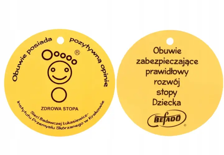 Żółty certyfikat "Zdrowa Stopa" z symbolem uśmiechniętej stopy i napisem "Obuwie zabezpieczające prawidłowy rozwój stopy Dziecka".