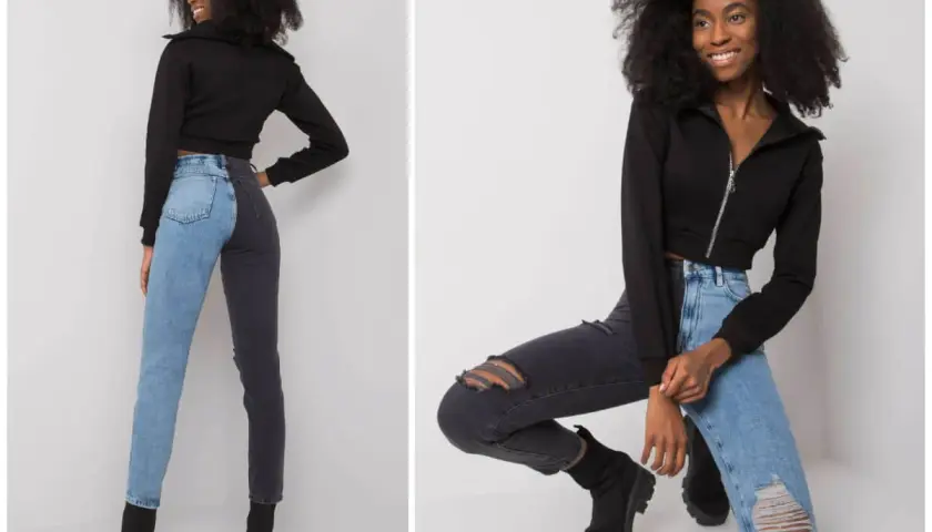 Modne stylizacje z jeansami: dwukolorowe spodnie i czarna bluza.
